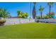Spacious backyard featuring well manicured artificial grass at 2446 E Hale St, Mesa, AZ 85213