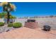 Brick barbecue in the patio area with mature landscaping at 2446 E Hale St, Mesa, AZ 85213