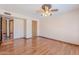 Bright bedroom featuring hardwood floors and a ceiling fan at 2446 E Hale St, Mesa, AZ 85213