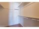 Empty walk-in closet featuring shelving and neutral paint at 2446 E Hale St, Mesa, AZ 85213
