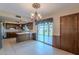 An open floor plan showcases a dinning area with a sliding door to the patio at 2446 E Hale St, Mesa, AZ 85213