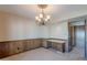 Dining room features neutral wall paint and a decorative chandelier at 2446 E Hale St, Mesa, AZ 85213