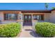 Inviting entryway with double doors, charming brick accents and manicured landscaping at 2446 E Hale St, Mesa, AZ 85213
