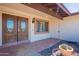 Charming entryway featuring double doors, tile flooring, and a brick accented window at 2446 E Hale St, Mesa, AZ 85213