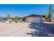 Charming single-story home featuring a two-car garage, desert landscaping, and a well-maintained front yard at 2446 E Hale St, Mesa, AZ 85213