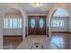 Elegant foyer with arched doorways, beautiful tile accents, and hardwood flooring throughout at 2446 E Hale St, Mesa, AZ 85213