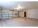 A spacious garage with an automatic door and a smooth floor at 2446 E Hale St, Mesa, AZ 85213