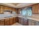 The kitchen is equipped with stainless steel appliances and tile countertops at 2446 E Hale St, Mesa, AZ 85213