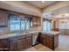 Traditional kitchen with tile countertops, wooden cabinetry, and stainless steel appliances at 2446 E Hale St, Mesa, AZ 85213