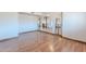 Spacious living room featuring hardwood floors, arched doorways, and abundant natural light at 2446 E Hale St, Mesa, AZ 85213