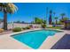 Backyard pool with mature landscaping and a clear blue water at 2446 E Hale St, Mesa, AZ 85213