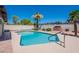 Backyard pool and patio area with mature landscaping and brick grill at 2446 E Hale St, Mesa, AZ 85213
