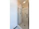 Shower featuring tiled walls, glass doors and brushed nickel hardware at 2446 E Hale St, Mesa, AZ 85213