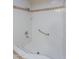Walk-in shower featuring custom tile work and convenient grab bar at 2446 E Hale St, Mesa, AZ 85213
