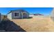Spacious backyard area featuring block fencing, offering privacy and potential for landscaping and customization at 24552 W Hilton Ave, Buckeye, AZ 85326