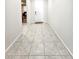 Inviting entryway features neutral paint, tile floors, and a view into an office space at 24552 W Hilton Ave, Buckeye, AZ 85326