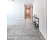 Welcoming entryway with neutral walls, tile floors, and stylish console table at 24552 W Hilton Ave, Buckeye, AZ 85326