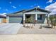 Inviting single-story home featuring a two-car garage, neutral color scheme, and landscaped front yard at 24552 W Hilton Ave, Buckeye, AZ 85326