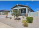 Charming single-story home with gravel landscaping, inviting front porch, and neutral color palette at 24552 W Hilton Ave, Buckeye, AZ 85326
