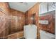 Bathroom featuring a tiled shower, white vanity, and modern fixtures at 2601 N 51St St, Phoenix, AZ 85008