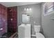Bathroom featuring vanity with updated fixtures, decorative tile, and shower at 2601 N 51St St, Phoenix, AZ 85008