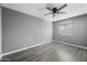 Bedroom featuring grey walls, wood-look floors and plenty of natural light at 2601 N 51St St, Phoenix, AZ 85008