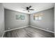 Neutral bedroom features dual windows and ceiling fan at 2601 N 51St St, Phoenix, AZ 85008