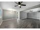 Bright, open living space with sleek gray flooring, ceiling fans, and seamless flow into other areas of the home at 2601 N 51St St, Phoenix, AZ 85008