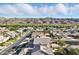 This gorgeous suburban neighborhood is framed by desert mountains and blue skies with puffy white clouds at 2822 E Constance Way, Phoenix, AZ 85042