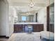 Luxurious bathroom showcasing dual sinks, chandelier, and a spacious vanity area with premium finishes at 2822 E Constance Way, Phoenix, AZ 85042
