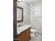 Elegant powder room features marble walls, ornate vanity, granite countertop, and framed mirror at 2822 E Constance Way, Phoenix, AZ 85042