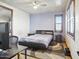 Inviting bedroom with a large bed, desk area, and abundant natural light at 2822 E Constance Way, Phoenix, AZ 85042