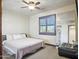 Relaxing bedroom with ceiling fan, neutral walls, and a cozy bed at 2822 E Constance Way, Phoenix, AZ 85042