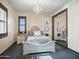 Stylishly designed bedroom features unique lighting fixtures, a large mirror, and a cozy bed at 2822 E Constance Way, Phoenix, AZ 85042