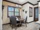 Cozy breakfast nook with a round wooden table, perfect for intimate dining and enjoying morning coffee at 2822 E Constance Way, Phoenix, AZ 85042