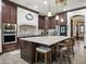 Gourmet kitchen with stainless steel appliances, granite countertops, a kitchen island, and custom cabinetry at 2822 E Constance Way, Phoenix, AZ 85042