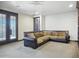Spacious living room boasts plush carpeting, neutral tones, and large comfortable brown couch at 2822 E Constance Way, Phoenix, AZ 85042