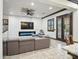 Modern living room with tiled floors, a large sectional, a fireplace and a custom ceiling design at 2822 E Constance Way, Phoenix, AZ 85042