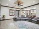 Spacious living room featuring a large sectional sofa, custom ceiling design, and easy access to the kitchen at 2822 E Constance Way, Phoenix, AZ 85042