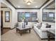Elegant living room featuring neutral colors, decorative ceilings, and large windows that bring in natural light at 2822 E Constance Way, Phoenix, AZ 85042