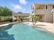 Beautiful backyard pool and outdoor entertainment space with a patio, lush landscaping, and an inviting pool at 2822 E Constance Way, Phoenix, AZ 85042