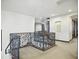 Second floor loft area featuring carpeted floors and an ornate wrought iron railing at 2822 E Constance Way, Phoenix, AZ 85042