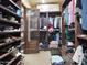Spacious walk-in closet with custom shelving and ample storage for shoes, clothes, and accessories at 2822 E Constance Way, Phoenix, AZ 85042