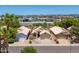 Aerial view of desert neighborhood homes, with solar panels and desert landscaping at 316 W Kelton Ln, Phoenix, AZ 85023