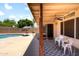 Relaxing backyard with pool and covered patio area at 316 W Kelton Ln, Phoenix, AZ 85023