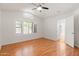 Bright bedroom with wood floors, ceiling fan and shuttered windows for ample natural light at 316 W Kelton Ln, Phoenix, AZ 85023