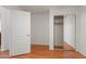 Bedroom featuring wood floors and a closet with mirrored doors, maximizing space and light at 316 W Kelton Ln, Phoenix, AZ 85023