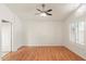 Spacious bedroom with wood floors, a ceiling fan and a large window at 316 W Kelton Ln, Phoenix, AZ 85023