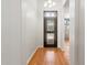Bright foyer with hardwood floors, a decorative security door, and neutral wall paint at 316 W Kelton Ln, Phoenix, AZ 85023