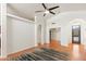 Open-concept living room featuring wood floors, high ceilings, and arched doorways at 316 W Kelton Ln, Phoenix, AZ 85023